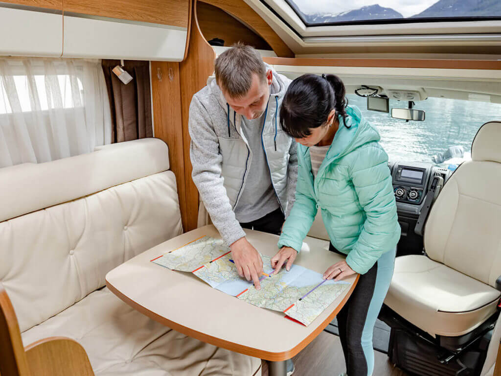 Couple planning road trip for RV vacation Couple planning road trip for RV vacation