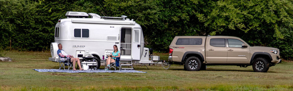 Boondocking America RV parked at the lake during the day